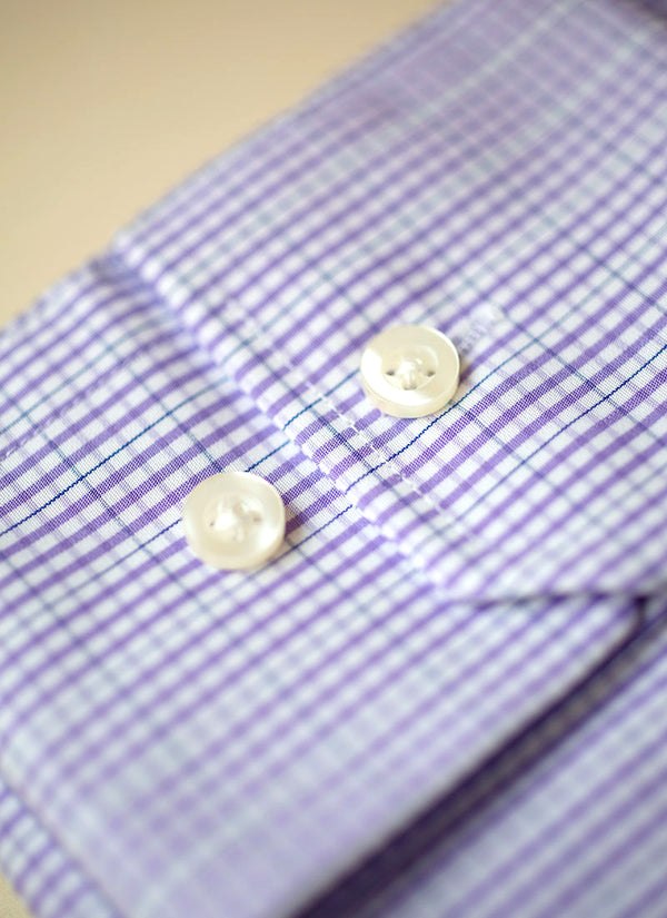 cuff detail image of purple gingham dress shirt with white buttons